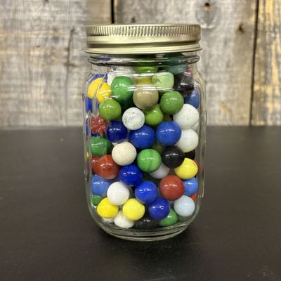 Sale Photo Thumbnail #441: A Collection of Assorted Machine-Made Opaque Glass Marbles in a Glass Mason Jar