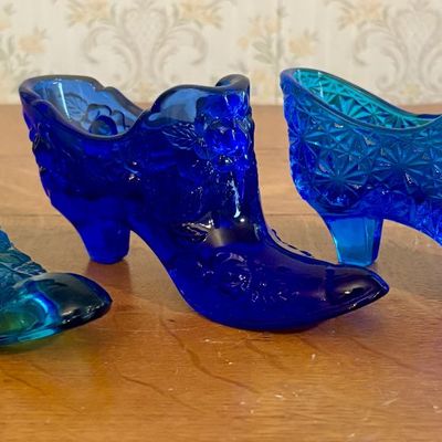 Sale Photo Thumbnail #255: Three Blue Pressed Glass Decorative Shoes Including Fenton Rose Pattern