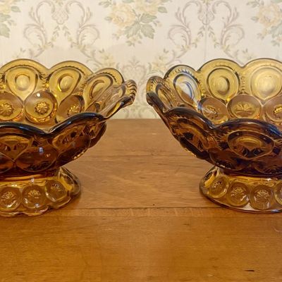 A Pair of Amber Pressed Glass Footed Bowls in the Moon and Star Pattern