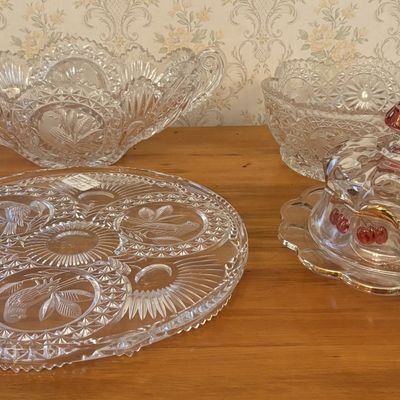 Sale Photo Thumbnail #580: A Collection of Colorless Pressed Glass Tableware Including Bird Motifs and a Gilt and Stained Covered Butter Dish