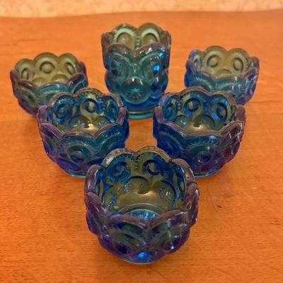 A Set of Six Teal Blue Moon and Star Pattern Pressed Glass Open Salts and Toothpick Holder
