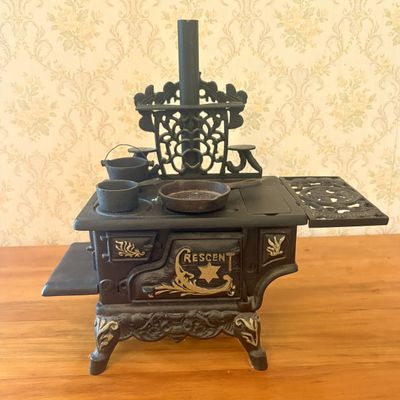 Sale Photo Thumbnail #464: Crescent Cast Iron Miniature Toy Cookstove with Three Accessories