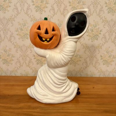 Sale Photo Thumbnail #385: Vintage Ceramic Light Up Ghost Holding Jack O Lantern Halloween Figurine