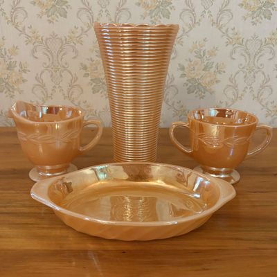 Sale Photo Thumbnail #444: A Collection of American Anchor Hocking Fire-King Peach Lustre Glassware Including Laurel and Swirl Patterns