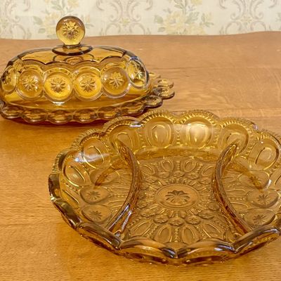 Two Amber Pressed Glass Divided and Covered Dishes in Moon and Star Pattern