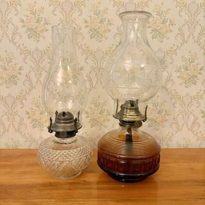 Sale Photo Thumbnail #387: Two Glass Oil Lamps Including One Amber Pressed Glass and One Clear Patterned Glass