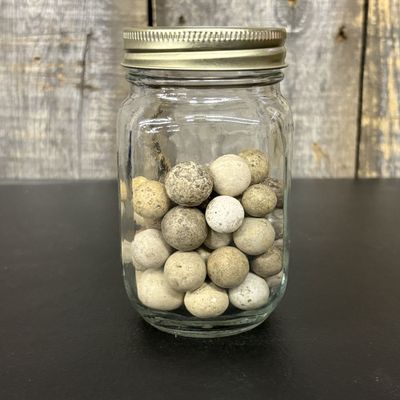 Sale Photo Thumbnail #663: A Collection of Antique Hand-Rolled Clay Marbles in a Glass Jar