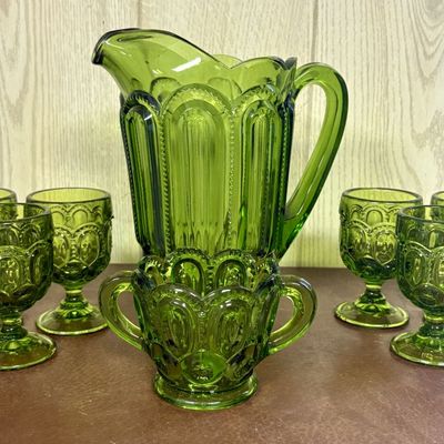 Sale Photo Thumbnail #688: A Set of Moon and Star Pattern Avocado Green Pressed Glass Beverage Ware and Service Pieces