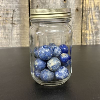 Sale Photo Thumbnail #432: A Collection of Approximately 22 Natural Stone Marbles in a Glass Jar