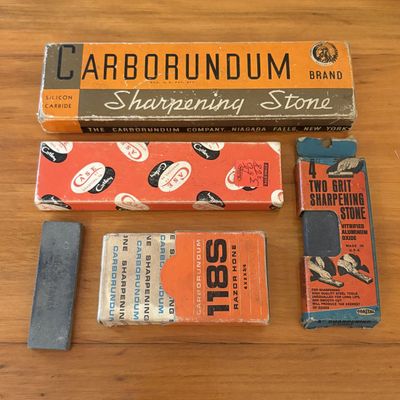 Sale Photo Thumbnail #349: A Collection of Vintage Sharpening Stones and Razor Hones Including Carborundum and Case Examples