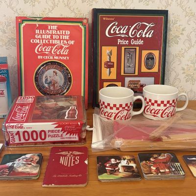 Sale Photo Thumbnail #522: An Assortment of Coca-Cola Brand Collectibles Including Reference Books, Holiday Housewares, and Games