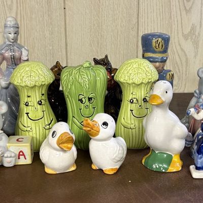 Sale Photo Thumbnail #691: A Collection of Approximately 18 Vintage Ceramic and Porcelain Figurines and Salt and Pepper Shakers