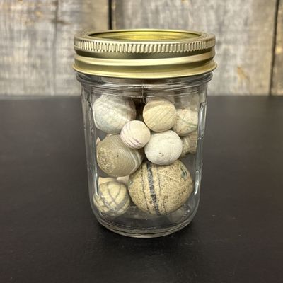 Sale Photo Thumbnail #767: A Collection of Antique Clay and Stone Marbles in a Glass Jar