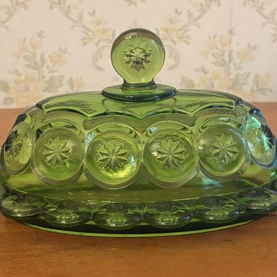 Pressed Green Glass Covered Butter Dish in Moon and Star Pattern