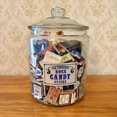 Sale Photo Thumbnail #424: A Collection of Vintage Advertising Matchbooks and Matchboxes in a Glass Rock Candy Apothecary Jar
