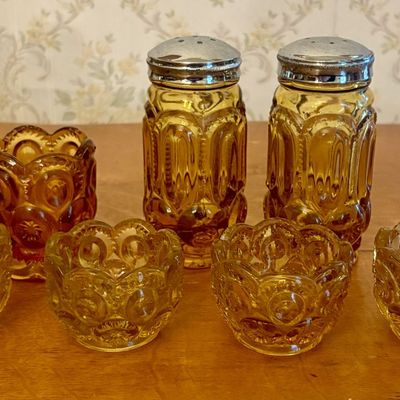 A Set of Amber Pressed Glass Moon and Star Pattern Tableware