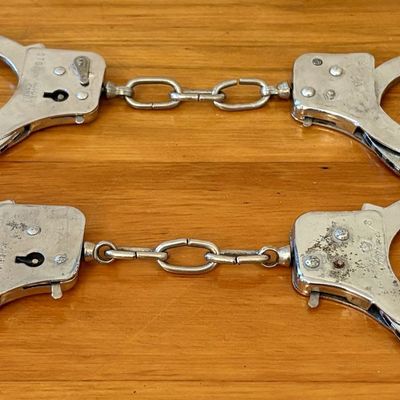 Sale Photo Thumbnail #570: Two Pairs of Nickel Plated Steel Double Locking Handcuffs