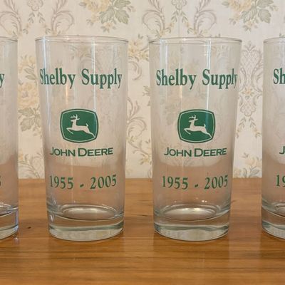 Sale Photo Thumbnail #612: Set of Four John Deere and Shelby Supply 50th Anniversary Glass Tumblers