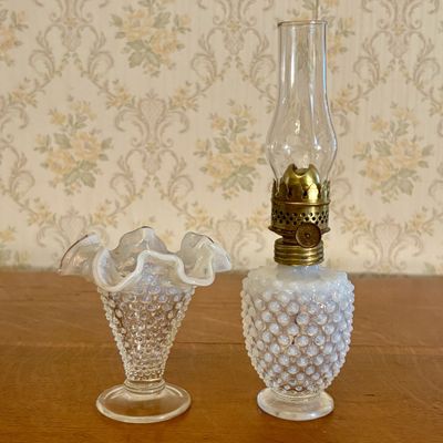Two Pieces of Opalescent White Hobnail Glass Including a Footed Vase and Miniature Nutmeg Oil Lamp