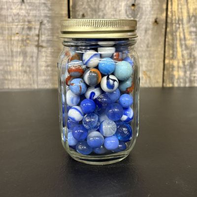 Sale Photo Thumbnail #655: A Collection of Assorted Vintage Glass Marbles in a Graduated Glass Jar