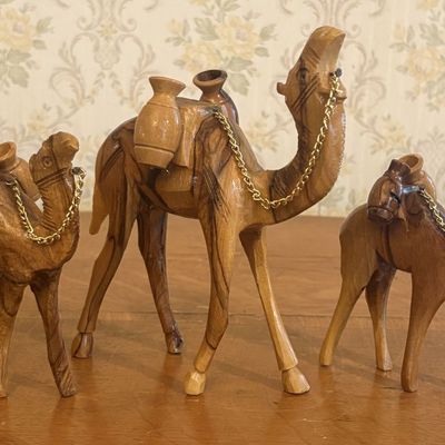 Sale Photo Thumbnail #121: A Trio of Graduated Hand Carved Olive Wood Camel Figurines