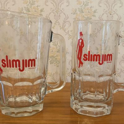 Sale Photo Thumbnail #630: A Two Piece Slim Jim Promotional Glassware Set Comprising a Pitcher and Large Mug