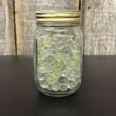 Sale Photo Thumbnail #311: A Collection of Vintage Glass Marbles in a Graduated Canning Jar