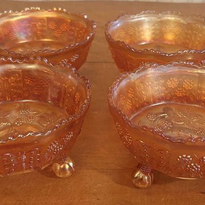 A Set of Marigold Carnival Glass Footed Butterfly and Berry Bowls