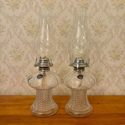 Sale Photo Thumbnail #323: A Pair of Lamplight Farms Clear Pressed Glass Kerosene Lamps