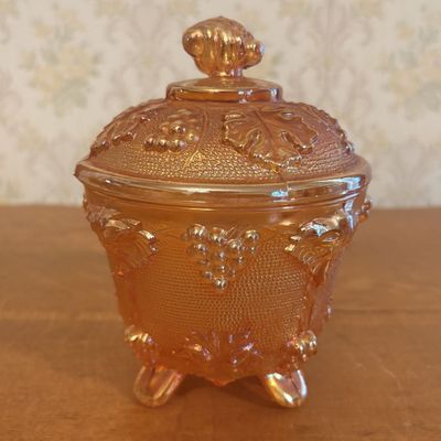 Footed Marigold Carnival Glass Covered Sugar Bowl in Grape and Cable Pattern