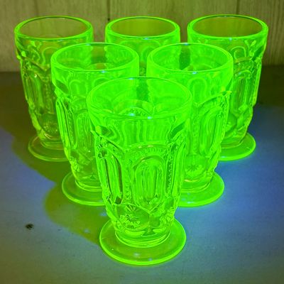 Sale Photo Thumbnail #756: Set of Six L.G. Wright Moon and Star Pattern Vaseline Glass Footed Tumblers