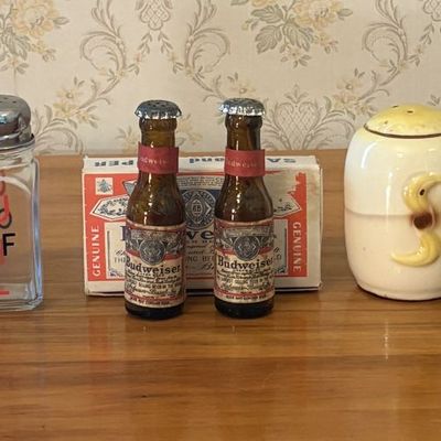 Sale Photo Thumbnail #542: An Assortment of Vintage Salt and Pepper Shakers Including Budweiser and University of Louisville Examples