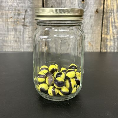 Sale Photo Thumbnail #662: A Collection of Swirl Glass Marbles in a Mason Jar