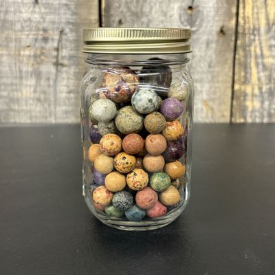 Sale Photo Thumbnail #560: A Collection of Antique Glazed and Painted Clay Marbles in a Glass Jar
