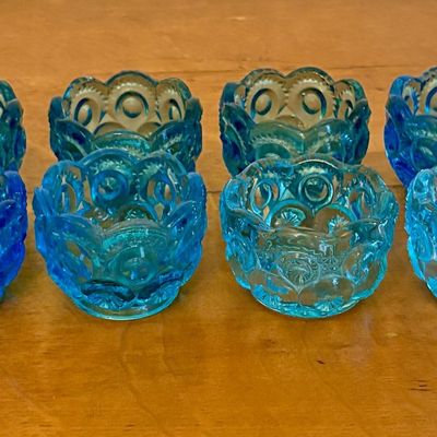 A Set of Eight Moon and Star Pattern Blue Pressed Glass Salt Cellars