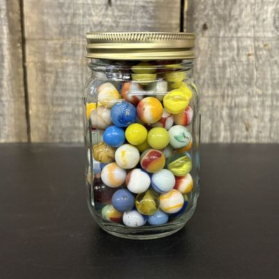 Sale Photo Thumbnail #310: A Collection of Vintage Glass Marbles in a Glass Mason Jar