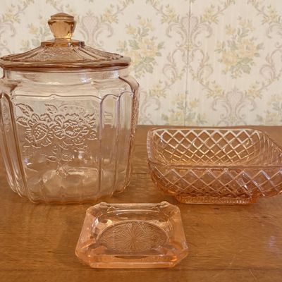 Three Pieces of Pink Depression Glass Including a Sunflower Pattern Cookie Jar