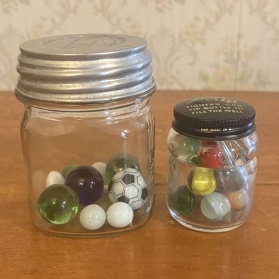 Sale Photo Thumbnail #144: A Pair of Vintage Glass Storage Jars Containing Assorted Marbles