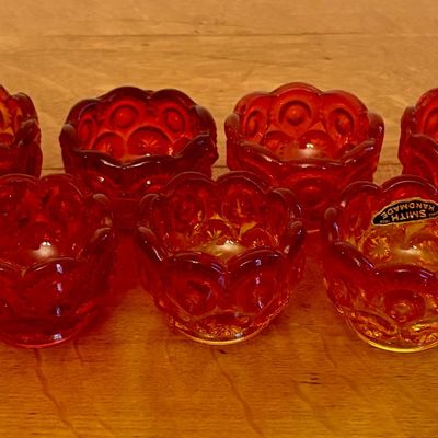 A Set of Seven L.E. Smith Amberina Glass Moon and Star Salt Cellars