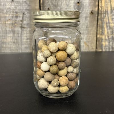 Sale Photo Thumbnail #442: A Collection of Vintage Hand Rolled Clay Marbles in a Glass Jar