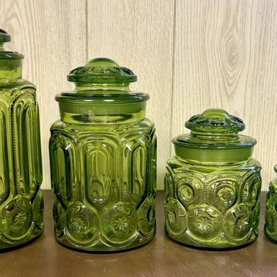 Sale Photo Thumbnail #677: A Set of Four Graduated Pressed Glass Kitchen Canisters in Moon and Star Pattern