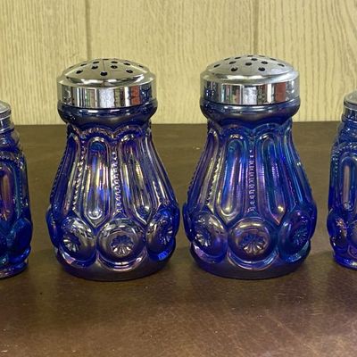 Sale Photo Thumbnail #705: A Collection of Cobalt Blue Carnival Glass Moon and Star Pattern Shakers