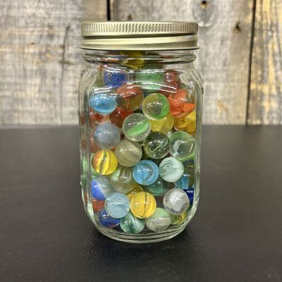 Sale Photo Thumbnail #653: An Assortment of Vintage and Modern Glass Marbles in a Glass Jar
