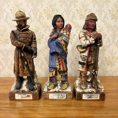 Sale Photo Thumbnail #379: Three McCormick C.M. Russell Whiskey Decanters The Stage Driver The Trapper and Flathead Squaw