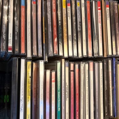 Large collection of classical, opera, and holiday CDs in jewel cases, featuring artists such as Yo-Yo Ma, Maria Callas, and the Royal...
