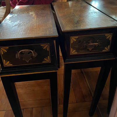 Set of vintage Asian-inspired tall side tables featuring painted black frames, yellow corner accents, decorative metal handles, and...