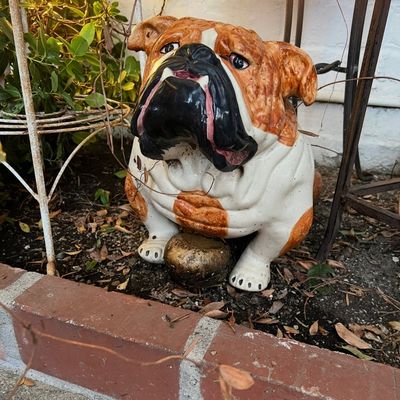 Vintage glazed ceramic English bulldog garden statue, featuring hand-painted detail and a seated stance.