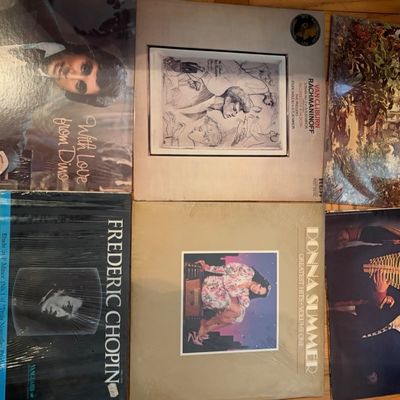 Collection of six vintage vinyl LP record albums, including artists like Donna Summer, Dean Martin, and classical works, several still in...