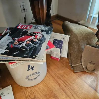 Vintage Western Pottery Co. 4-gallon stoneware crock topped with a stack of vintage LIFE magazines, including the February 5, 1965 issue...