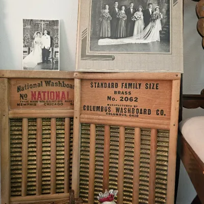 Two vintage wooden washboards, including a National Washboard No. 801 and a Columbus Washboard Co. No. 2062, displayed alongside...
